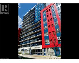 A tall building with a red section in the middle.