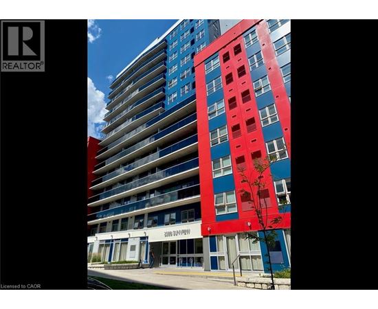 A tall building with a red section in the middle.