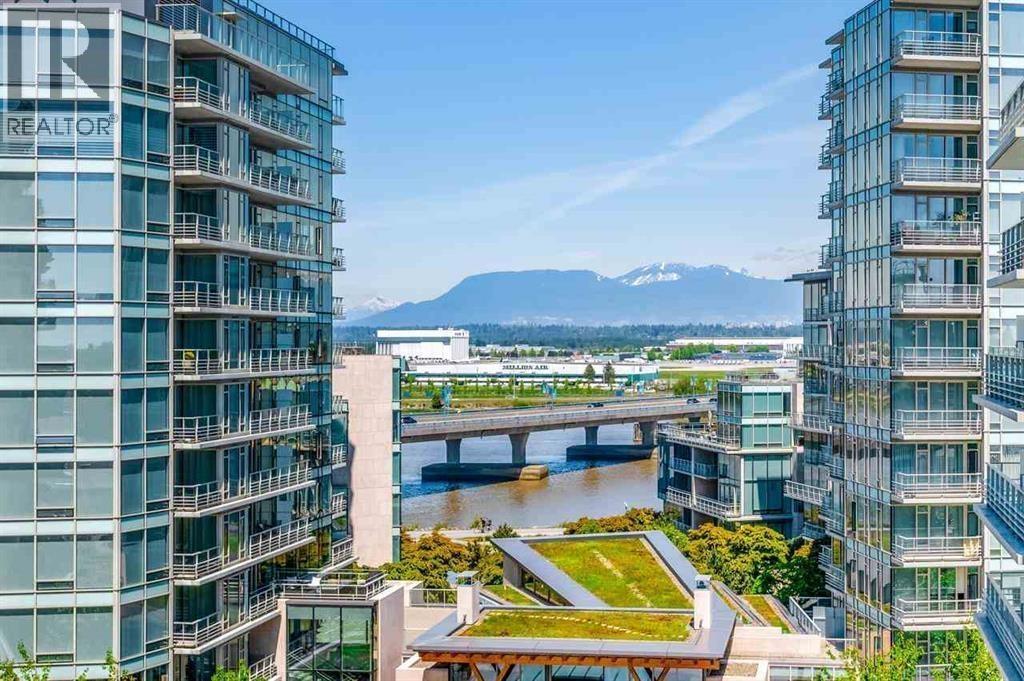 A view from a high-rise building looking down at a river and a bridge.
