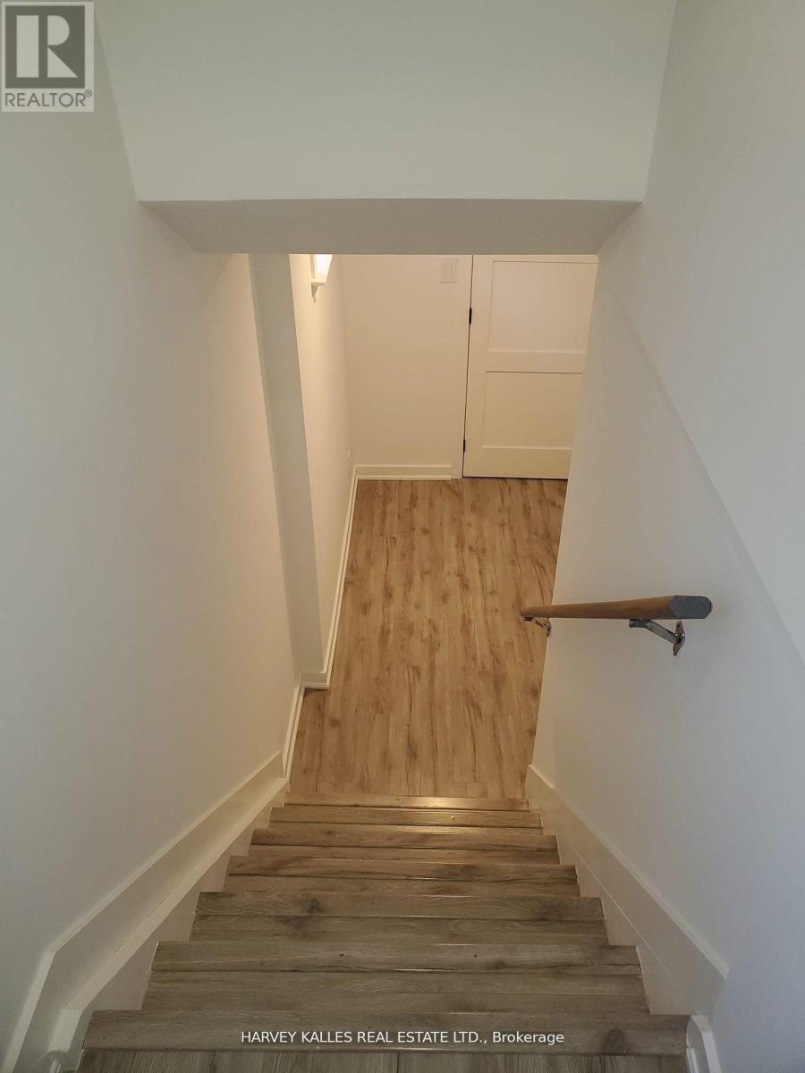 A staircase with wooden steps and a handrail.