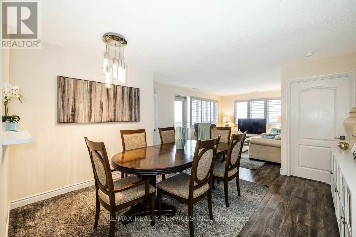 A dining room with a table set for four.
