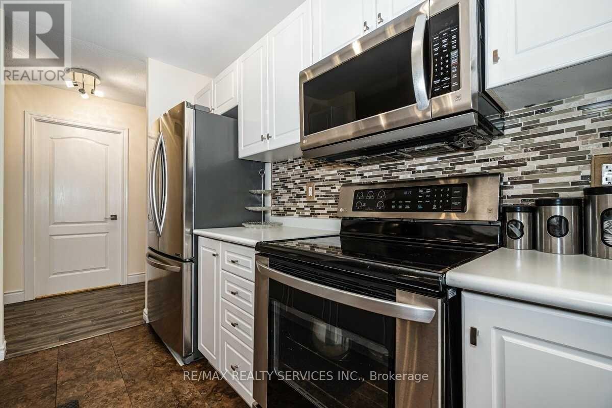 A kitchen with a stove top oven and microwave above it.