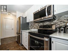 A kitchen with a stove top oven and microwave above it.