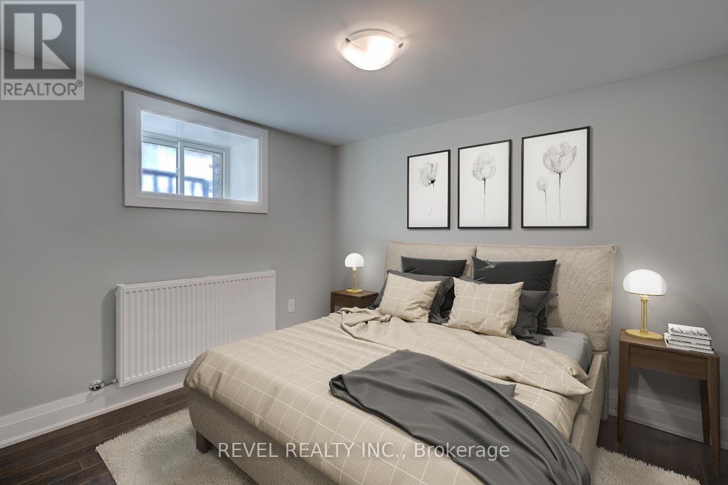A bedroom with a bed, nightstands, and pictures on the wall.