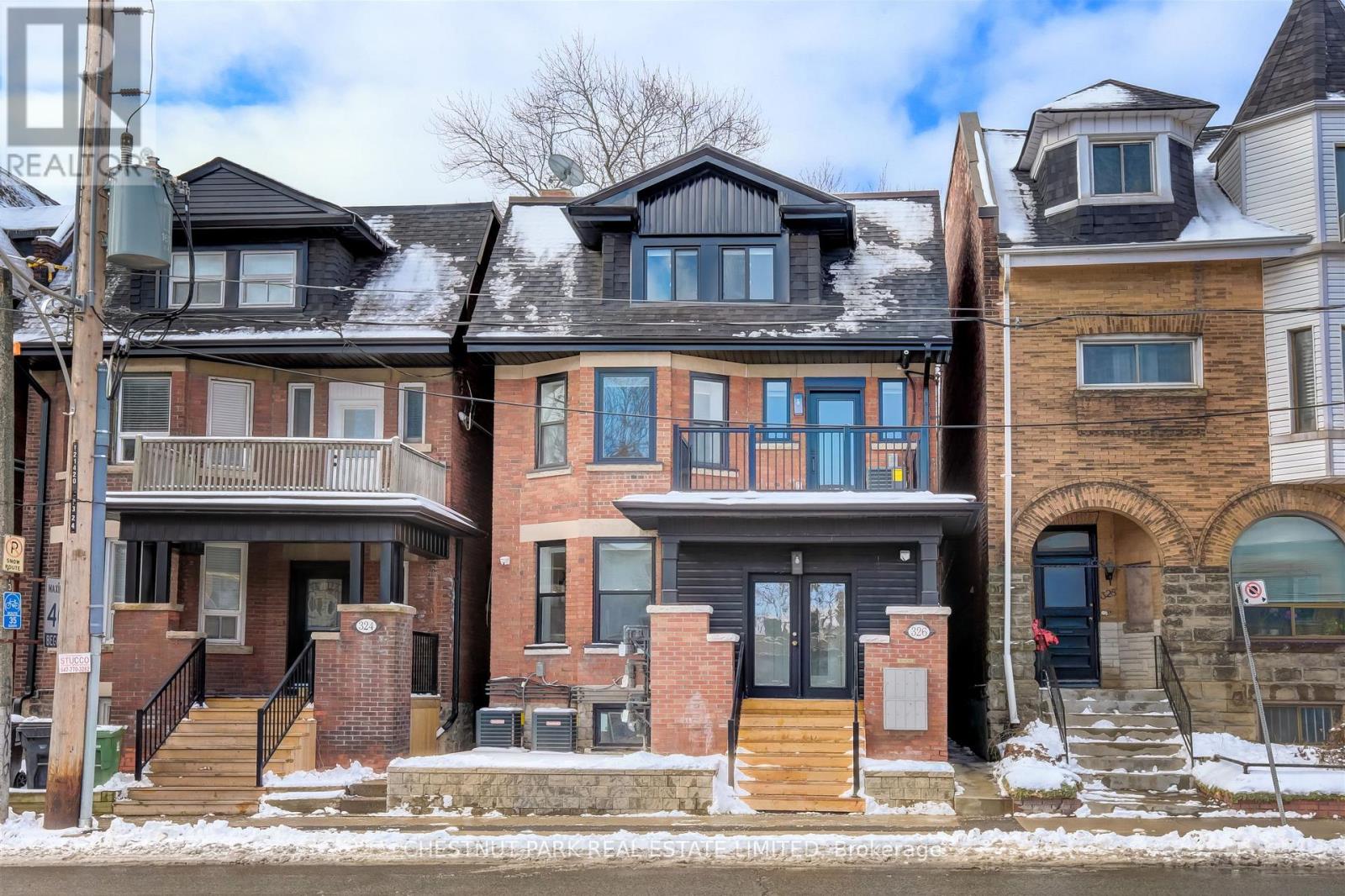 A row of houses with different architectural designs.