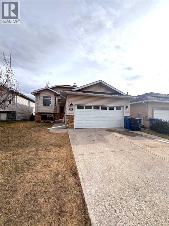 A house with a garage is for sale.