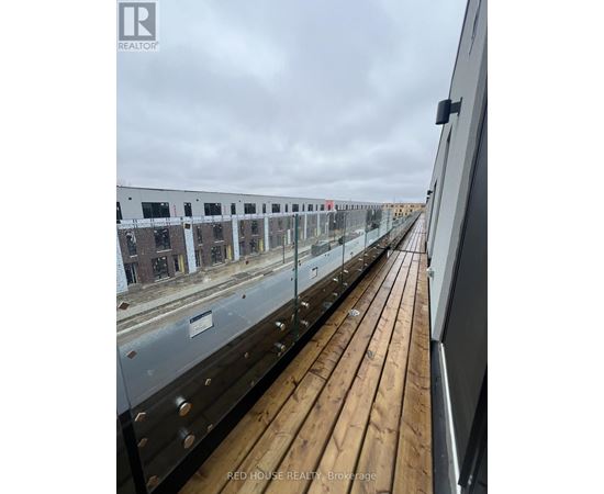 A view from a balcony looking down at a building under construction.