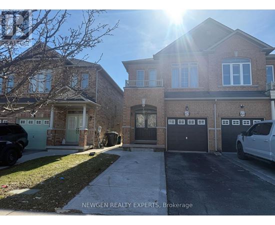 A sunny day at a residential area with houses and parked cars.