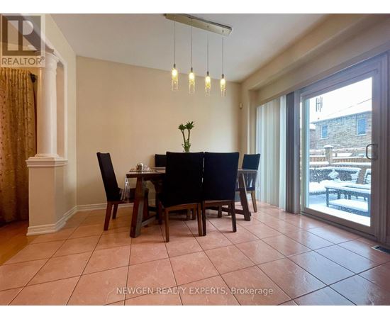 A dining room with a table set for four.