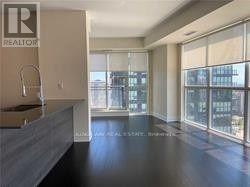 A realtor's office with a large window overlooking a cityscape.