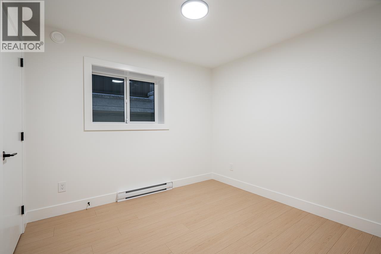 A room with a window and a door.