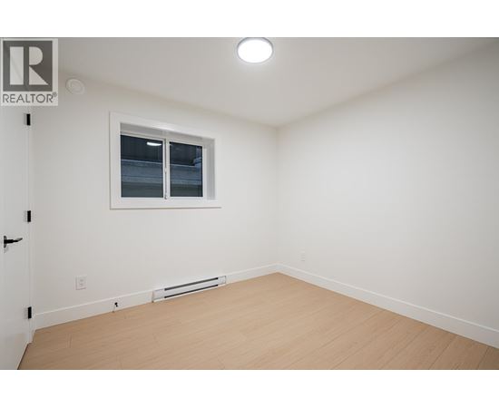 A room with a window and a door.