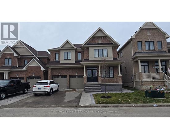 A house with a car parked in front of it.