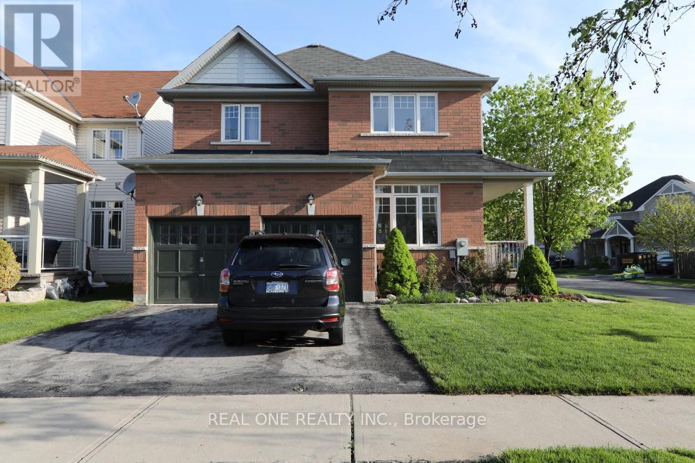 A house with a garage and a car parked in front.