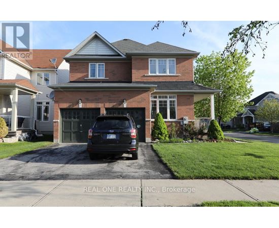 A house with a garage and a car parked in front.
