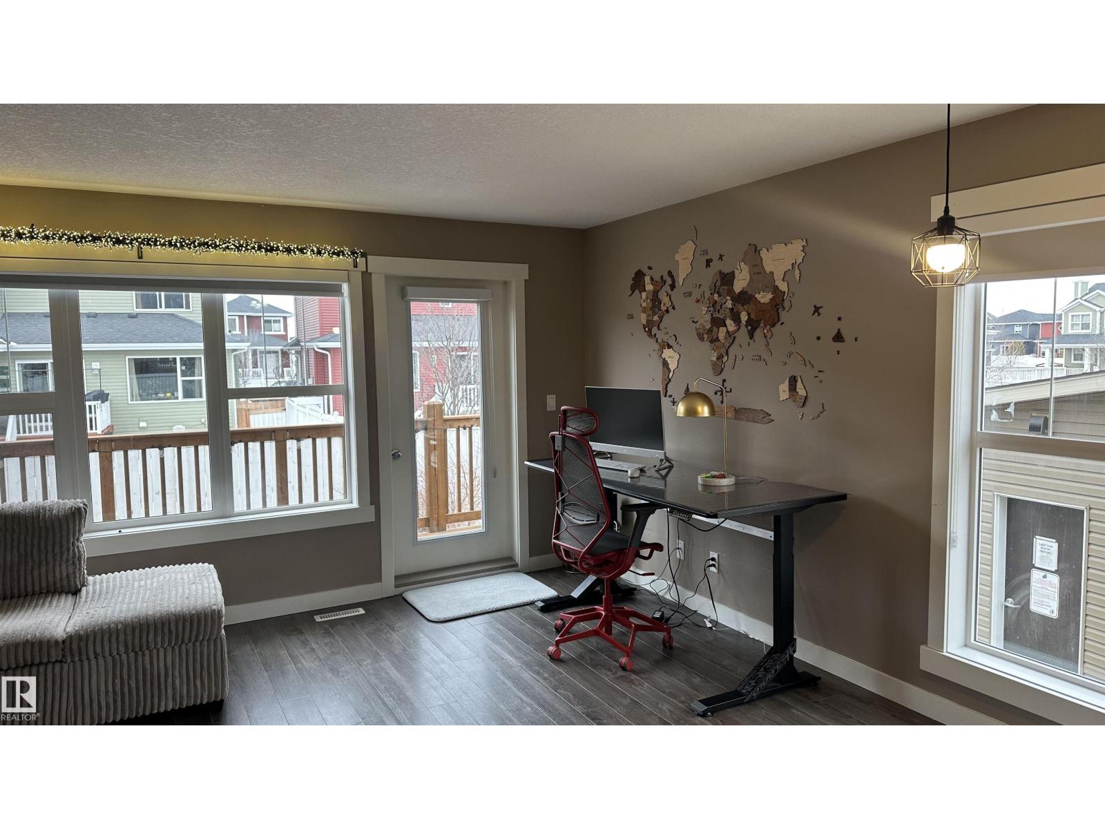 A room with a desk and a chair.