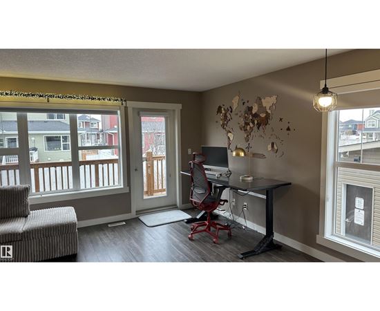 A room with a desk and a chair.