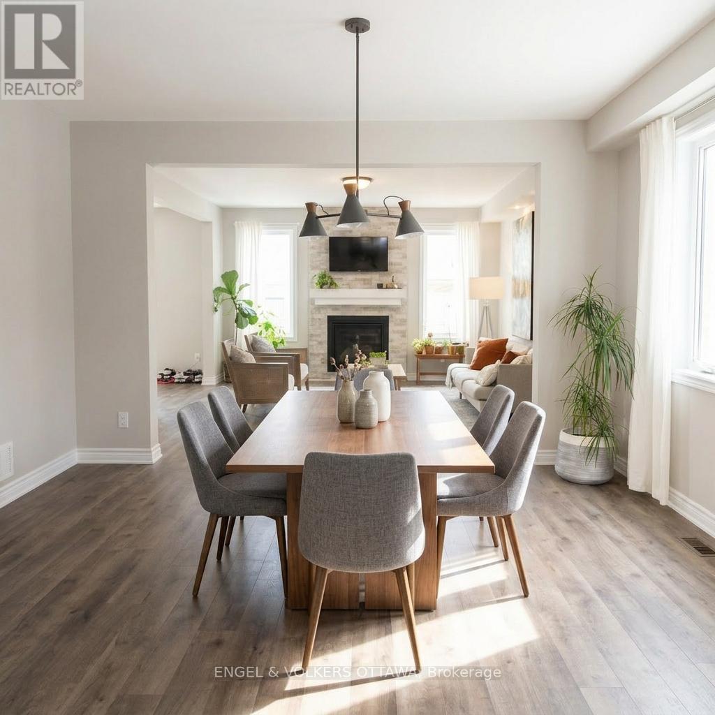 A modern dining room with a wooden table and grey chairs.
