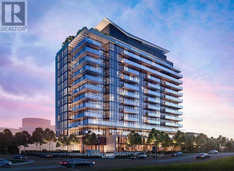 A modern apartment building with a glass facade and a parking lot in front.