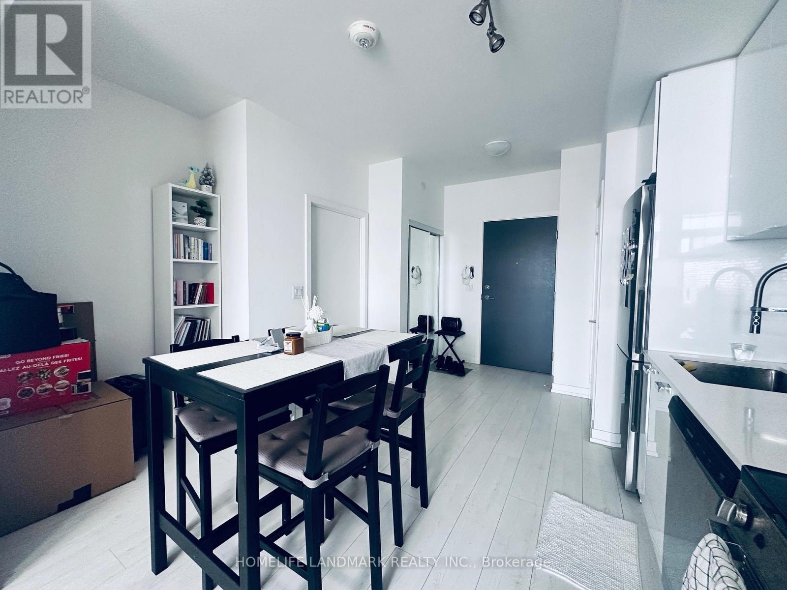 A dining area with a table and chairs is shown in the image.