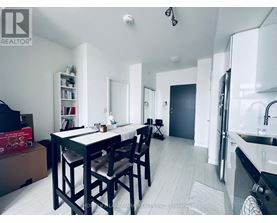 A dining area with a table and chairs is shown in the image.