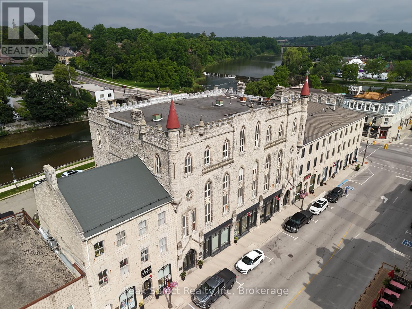 A realtor brokerage office is located in a castle-like building.