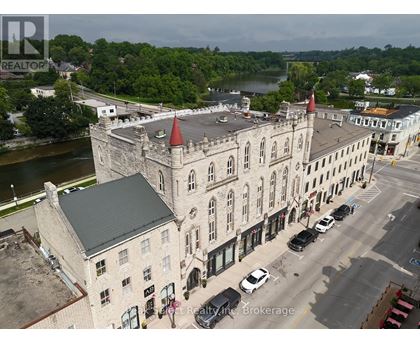 A realtor brokerage office is located in a castle-like building.