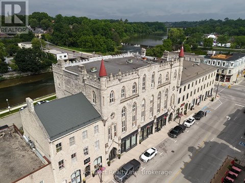 A realtor brokerage office is located in a castle-like building.