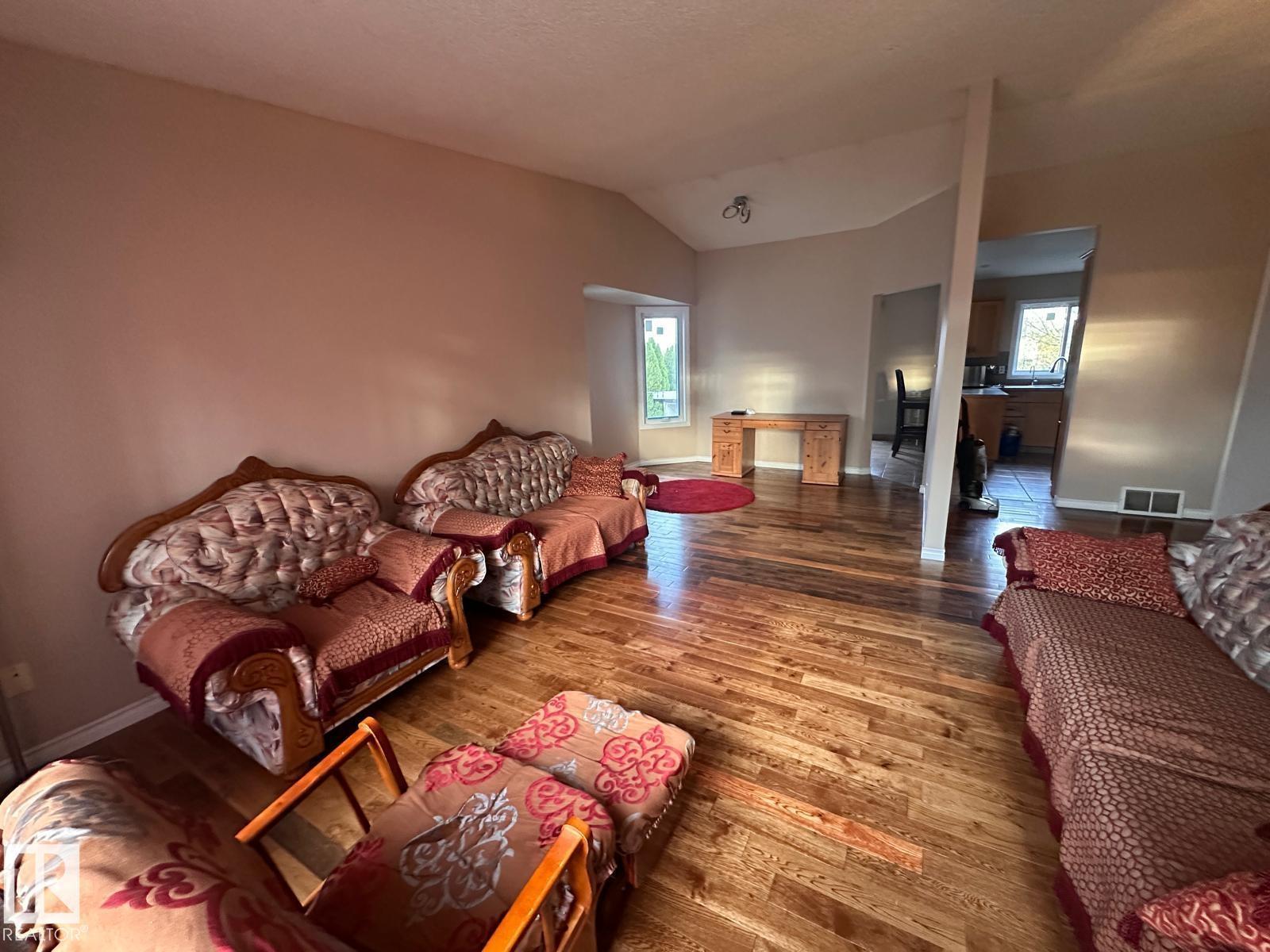 A living room with a couch and a chair.