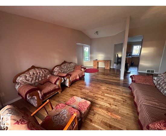 A living room with a couch and a chair.