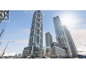 Two tall buildings stand next to each other in a city.