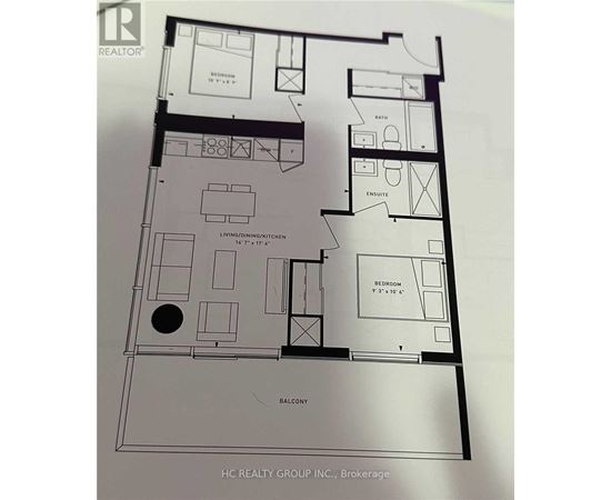A floor plan of an apartment with a living room, kitchen, and two bedrooms.