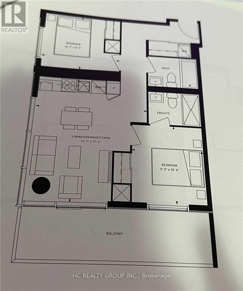 A floor plan of an apartment with a living room, kitchen, and two bedrooms.