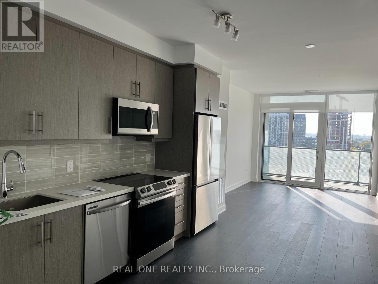 A modern kitchen with a microwave above the stove.