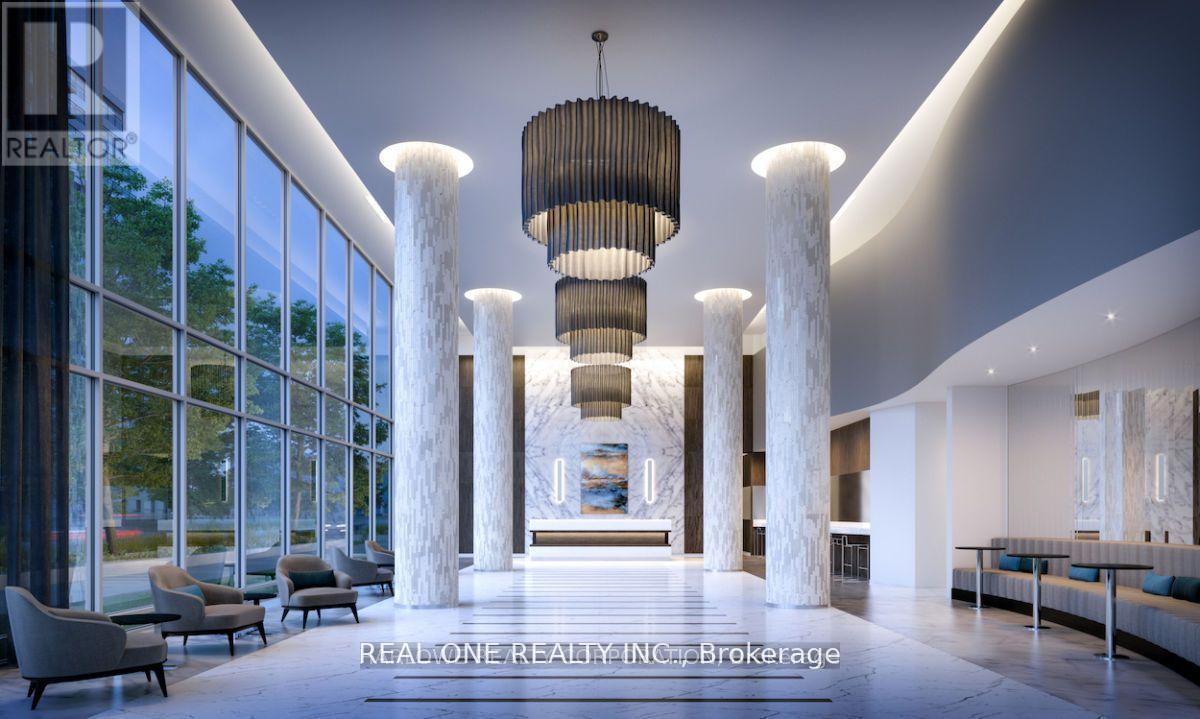 A modern interior space with a large chandelier and multiple columns.