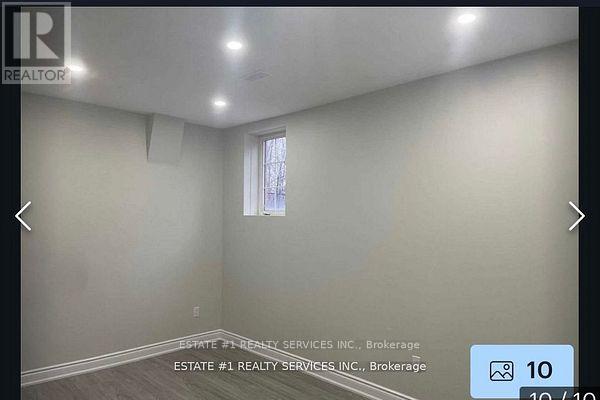 A room with a window and a sign that says REALTOR.