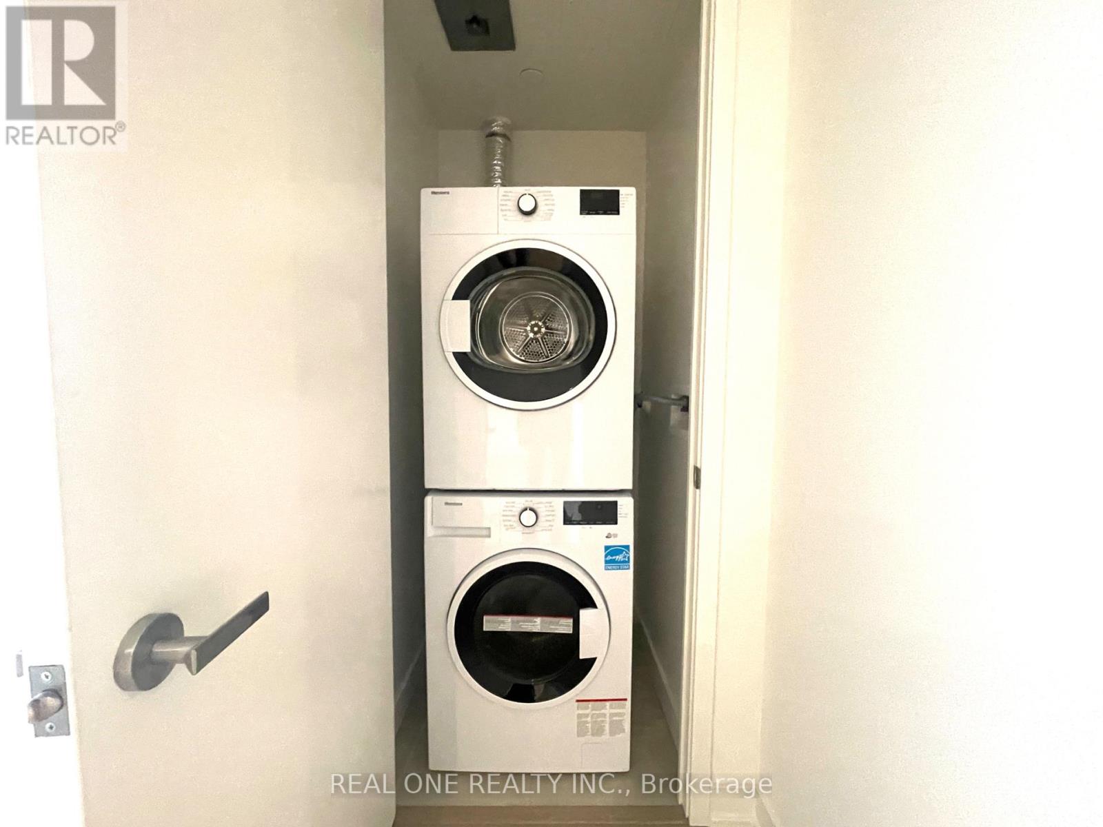 A washer and dryer stacked on top of each other in a small space.