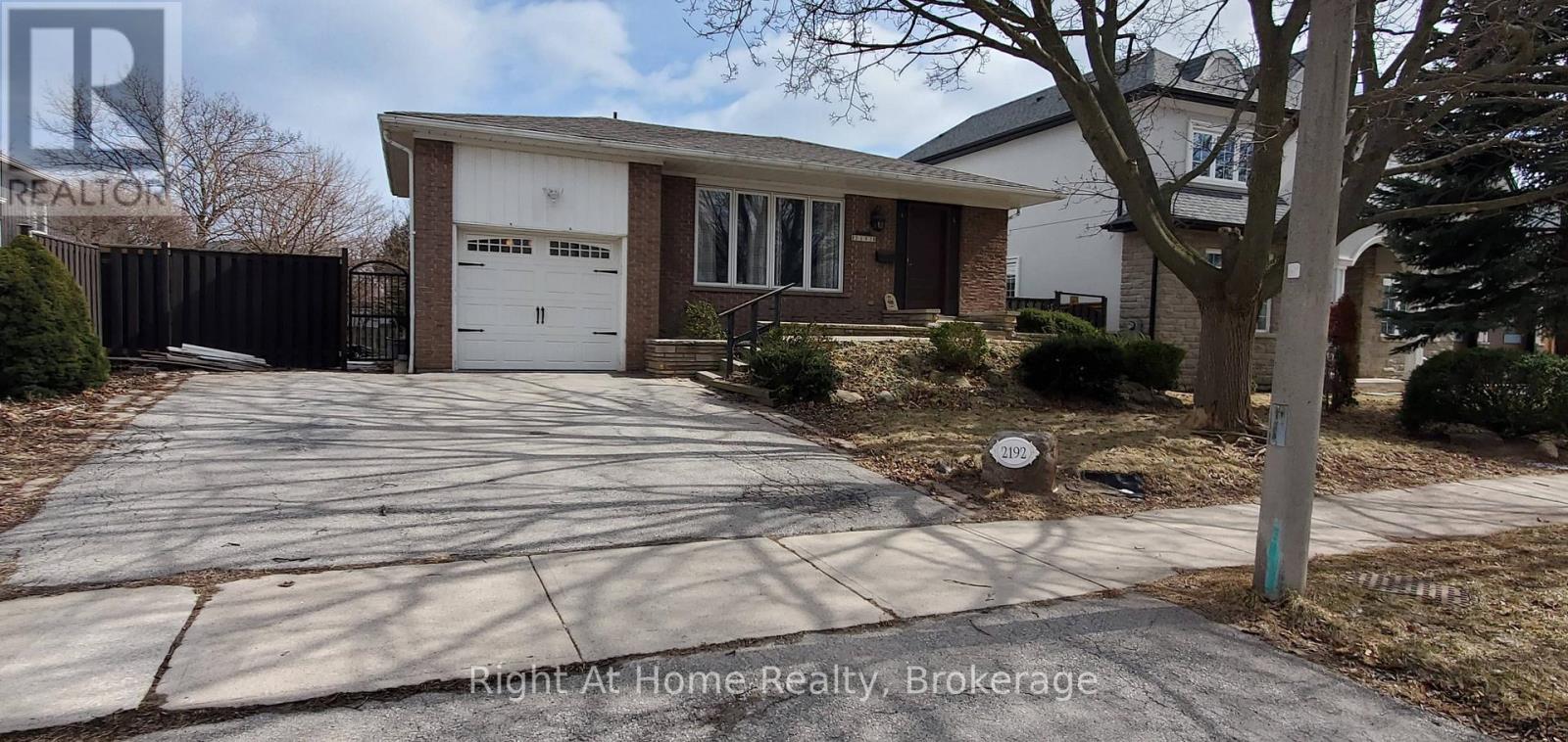 A house with a driveway in front of it.