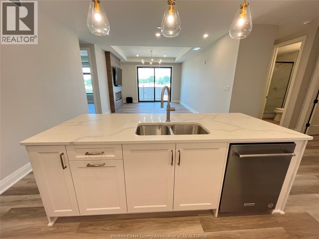 A kitchen with a sink and a dishwasher.