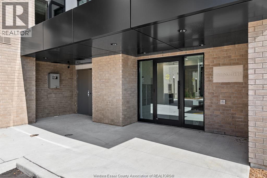 A building entrance with glass doors and a sign that says "REALTOR".
