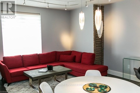 A red couch is in the living room.