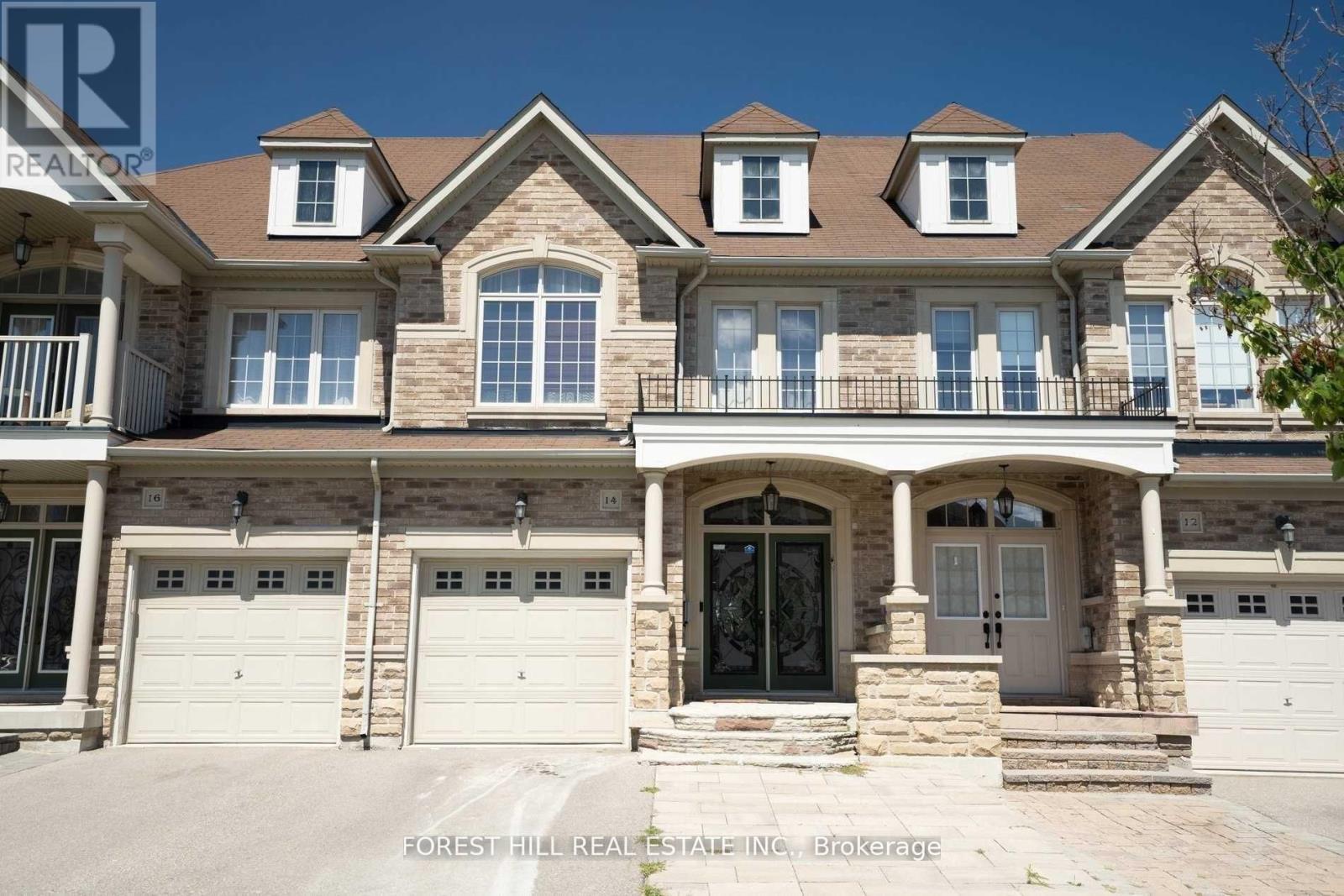 A large house with a balcony and a garage.