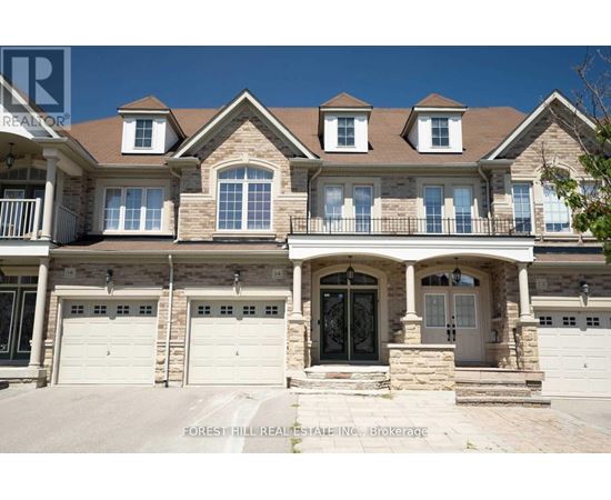 A large house with a balcony and a garage.