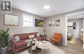A living room with a couch, a chair, a coffee table, and pictures on the wall.