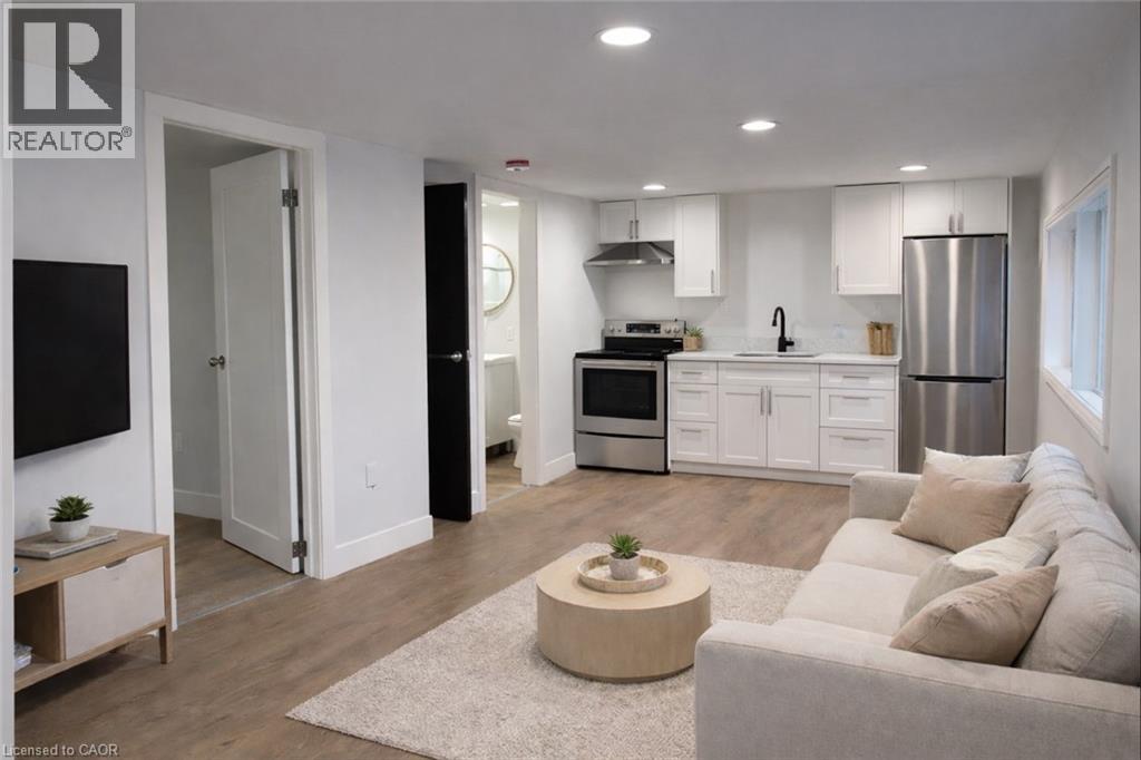 A modern living room with a grey couch and a coffee table.