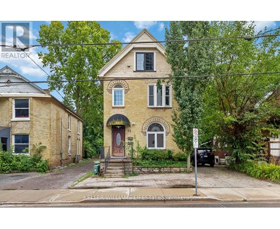 A house with a red door and a sign that says no parking.