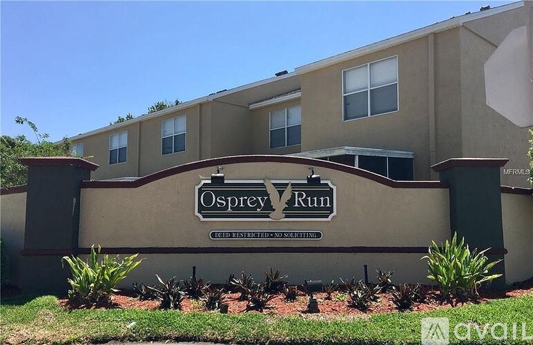The Osprey Run apartment complex is surrounded by greenery.