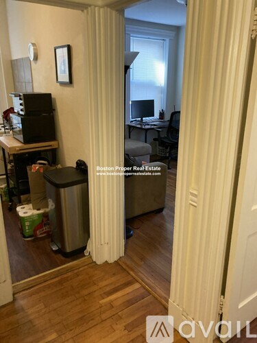 A room with a desk and a computer monitor.