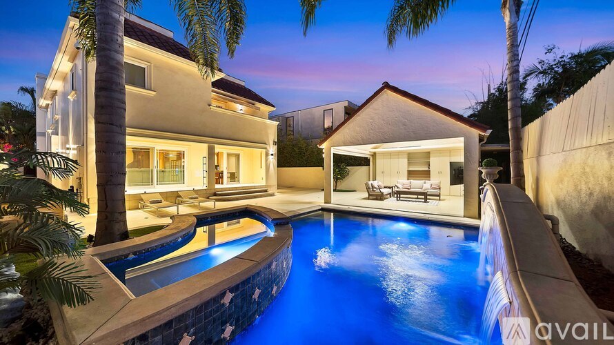 A modern house with a swimming pool in the backyard.