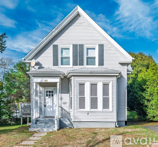 A two-story house with a porch and a front door.